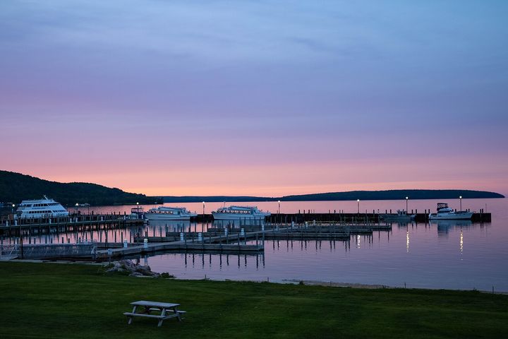 Boats docked in the Munising harbor on Munising Bay at dusk