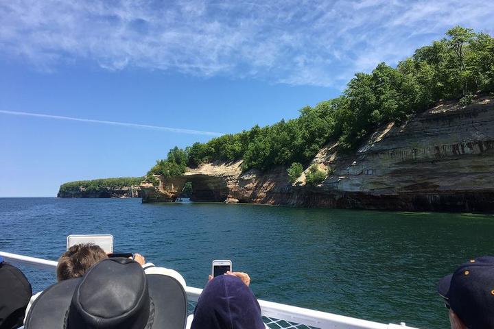 Passengers on a Pictured Rocks cruise photographing the cliffs