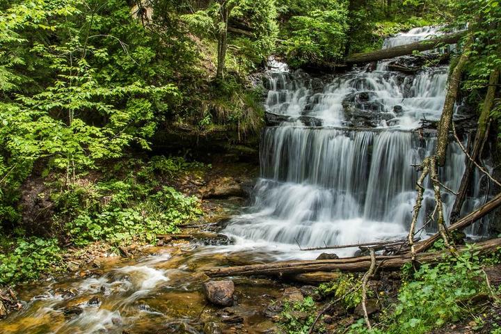 Wagner Falls cascading through the forest