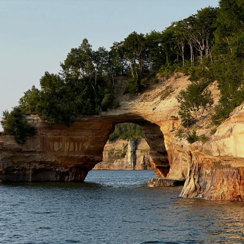 Sandstone arch and cliffs at Pictured Rocks